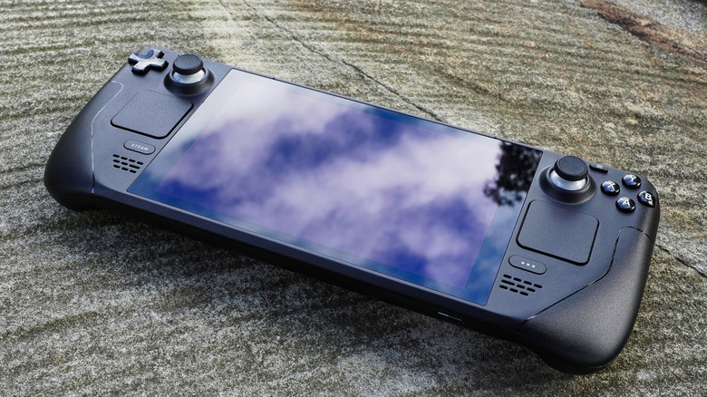 Steam Deck sitting outside on a stone surface