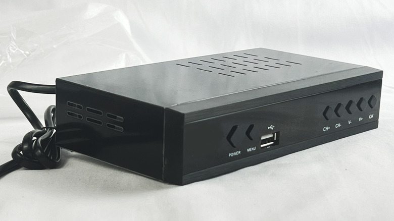 A black set top box for access to television channels and streaming services