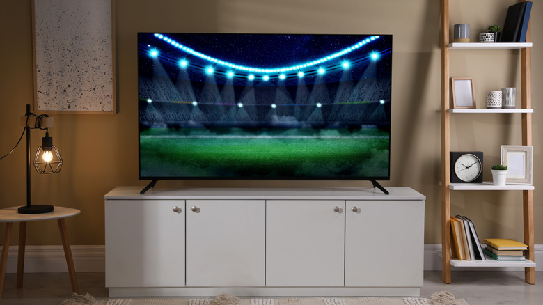 TV on stand with vibrant image showing bright lights