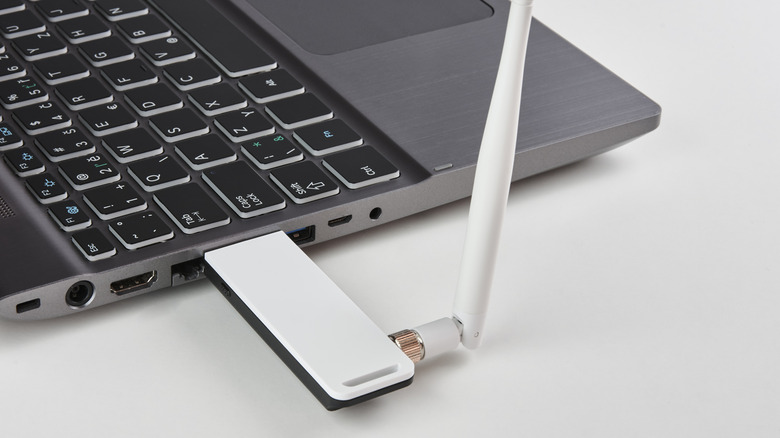 wi-fi adapter plugged into usb port on laptop side