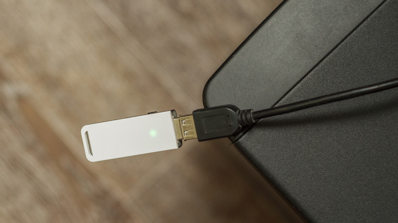Wi-fi adapter plugged into an expanded USB cable
