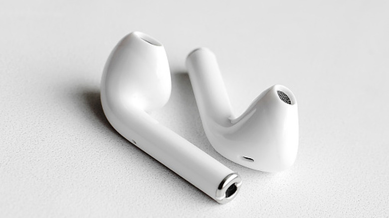 A pair of white earbuds