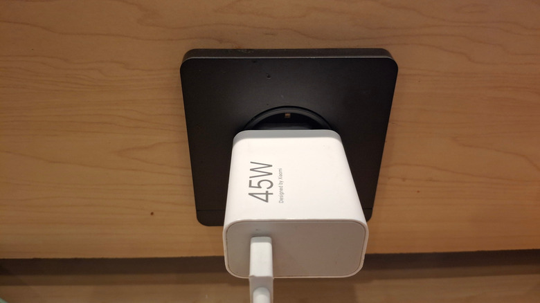 45 W Xiaomi charger plugged into a socket