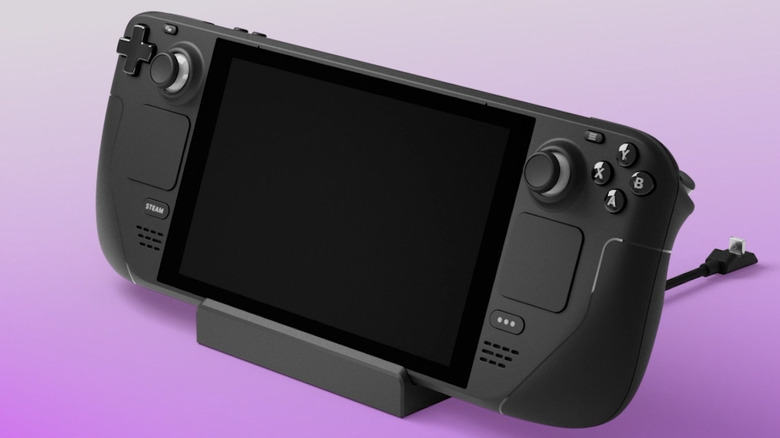 Steam Deck Docking Station with Steam Deck on it over a pink background