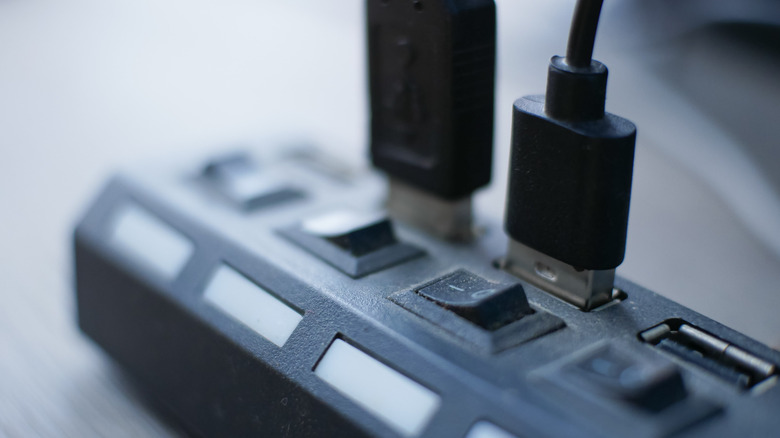 A powered USB hub with two of its ports in use.