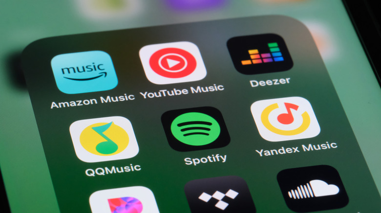 youtube music icon next to several other music app icons on smartphone