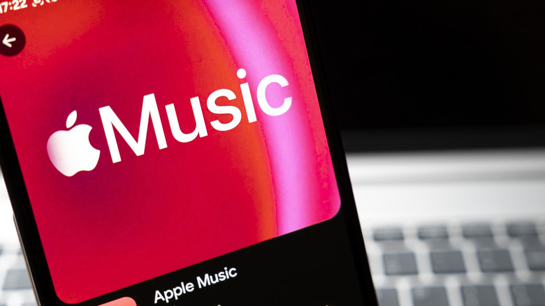 Apple Music logo on a handheld device