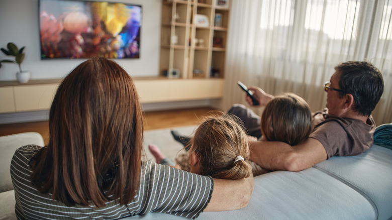 A family watching TV in their living room