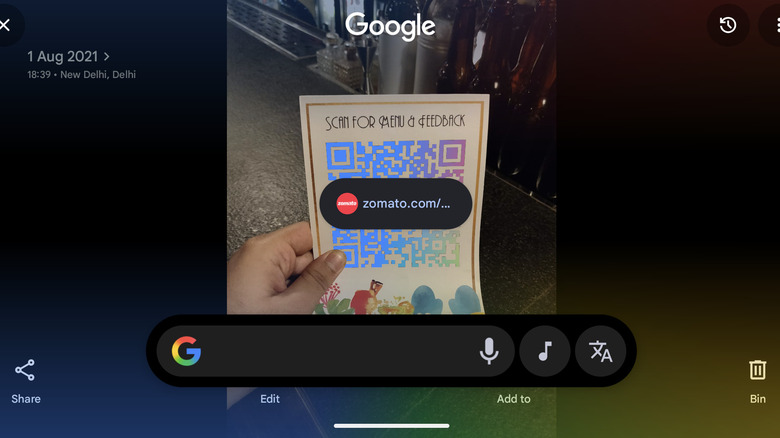 An image of a QR code, with its Zomato redirect  link floating over it in Circle to Search mode