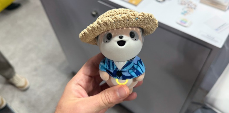 Poketomo AI companion figure in hand